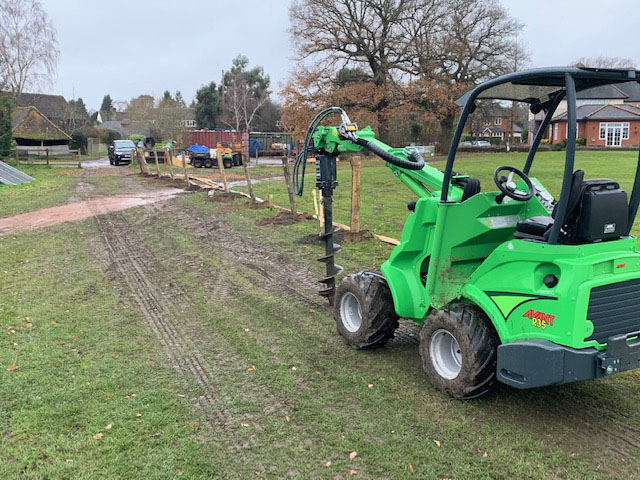 Avant loader with fence post attachment